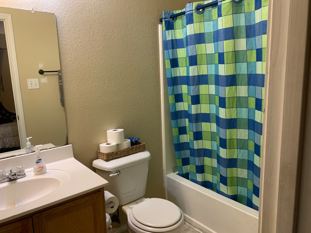 Bathroom 1 has a bath tub and shower combo 